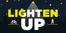 black image with the words "Lighten Up" as if under a streetlight