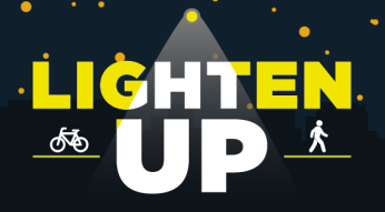 black image with the words "Lighten Up" as if under a streetlight
